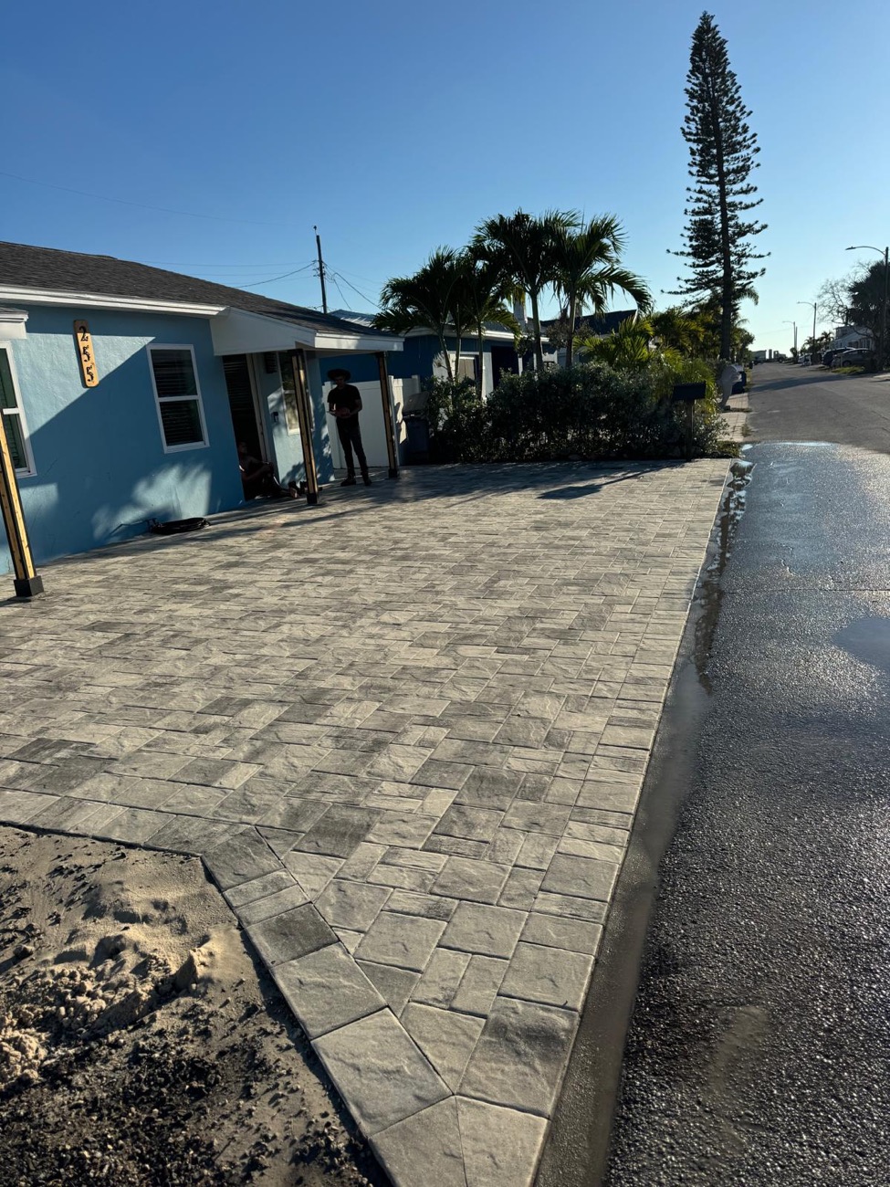 Paver driveway leading to the street