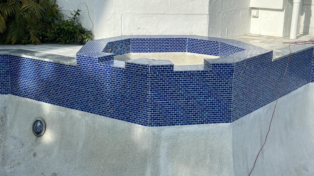 Raised spa with blue tile