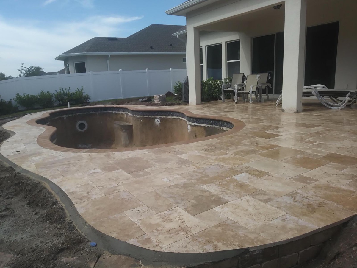 Travertine pool deck around a new pool